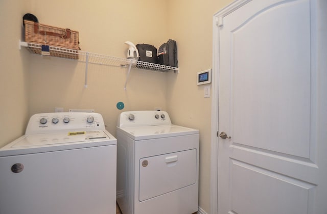 laundry room with washing machine and dryer