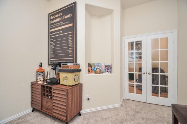 interior details featuring carpet and french doors