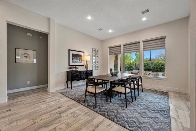 dining space featuring light wood-type flooring