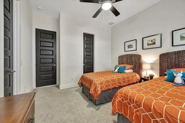 bedroom featuring ceiling fan and light colored carpet