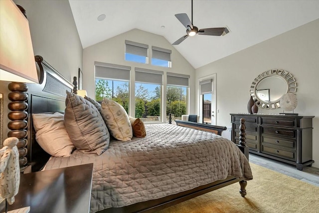 bedroom with high vaulted ceiling, light hardwood / wood-style flooring, and ceiling fan