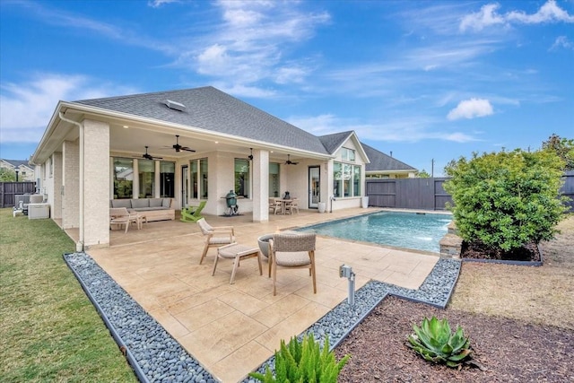 view of swimming pool with ceiling fan, pool water feature, a patio, and an outdoor hangout area