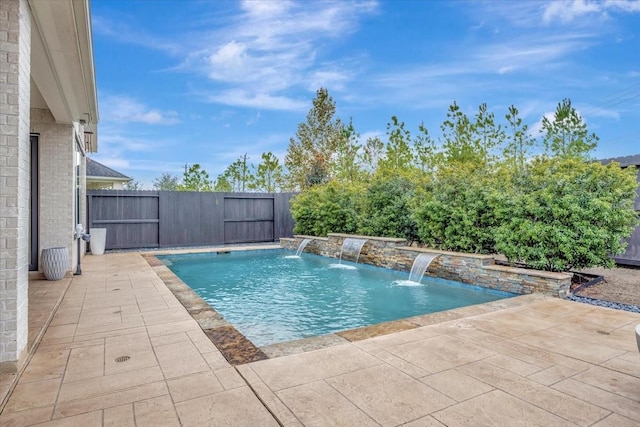 view of pool with pool water feature and a patio area