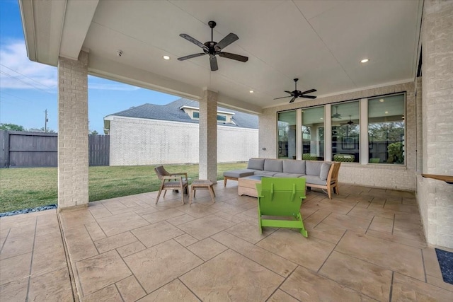 view of patio with ceiling fan and an outdoor hangout area