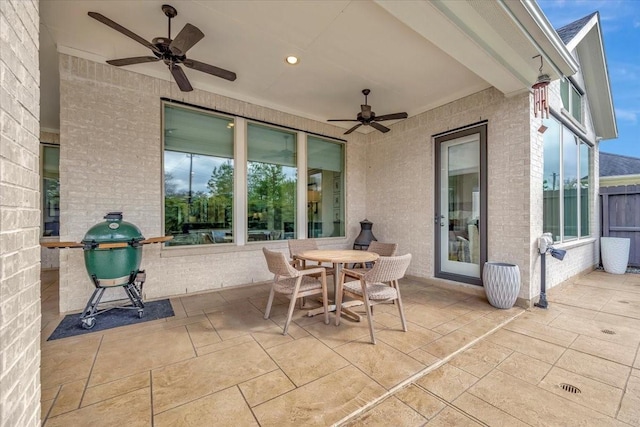 view of patio featuring ceiling fan