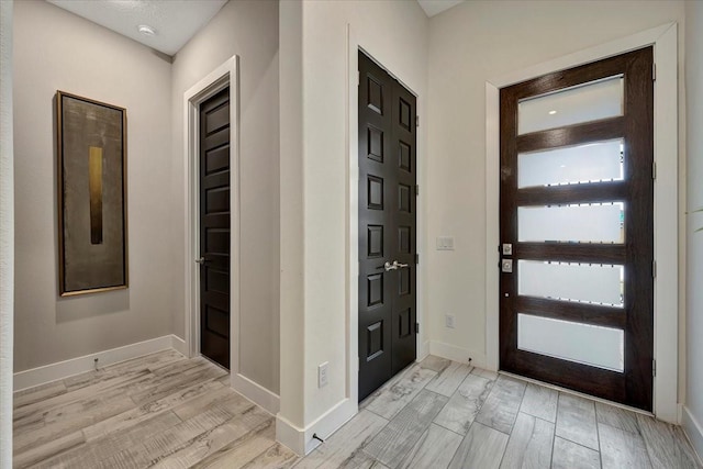 entrance foyer featuring light wood-type flooring