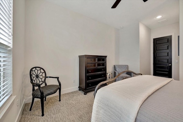 bedroom featuring ceiling fan and light colored carpet