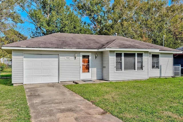 single story home featuring a front yard and a garage