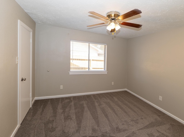 carpeted spare room with a textured ceiling and ceiling fan