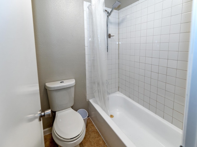 bathroom with tile patterned floors, toilet, and shower / tub combo with curtain