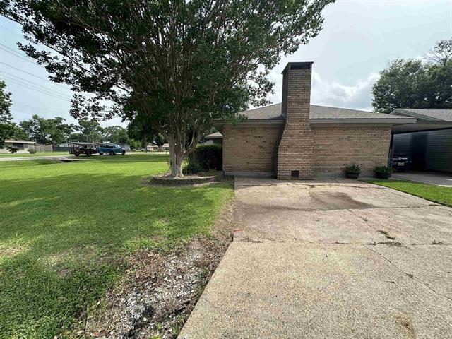 view of home's exterior featuring a yard