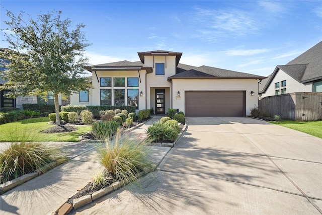 view of front of house with a garage and a front lawn