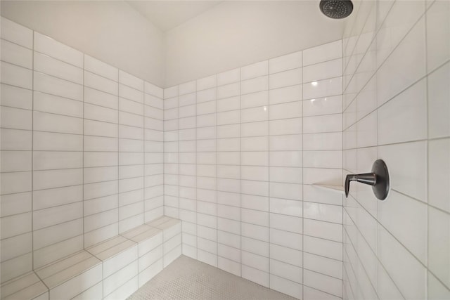 bathroom with a tile shower