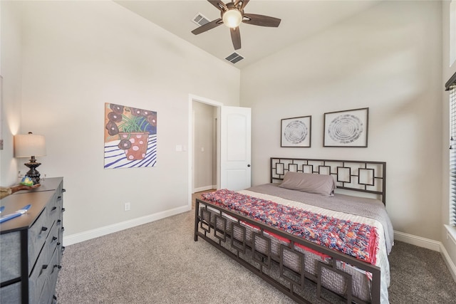 carpeted bedroom featuring high vaulted ceiling and ceiling fan