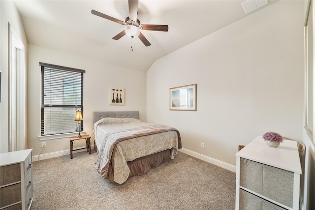 bedroom with ceiling fan, light colored carpet, and lofted ceiling