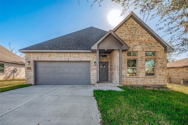 view of front of property with a garage and a front yard