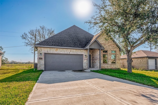 view of front facade featuring a garage and a front lawn