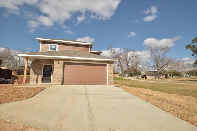 view of front of property with a garage and a front lawn