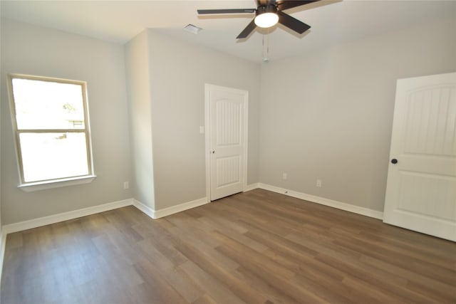 spare room featuring ceiling fan and hardwood / wood-style floors