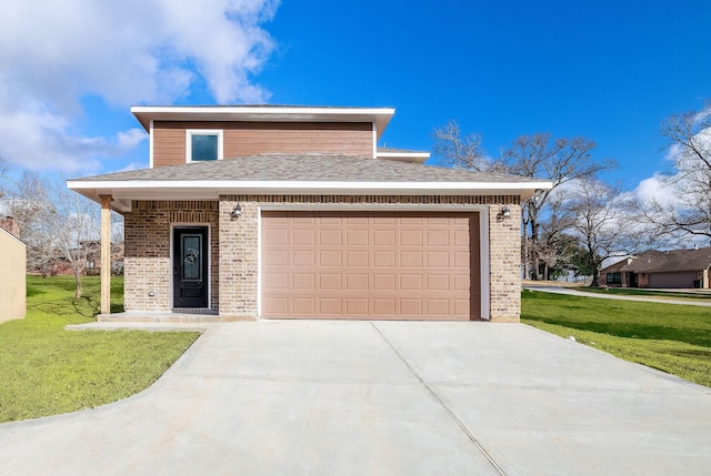 view of front of property with a garage and a front lawn