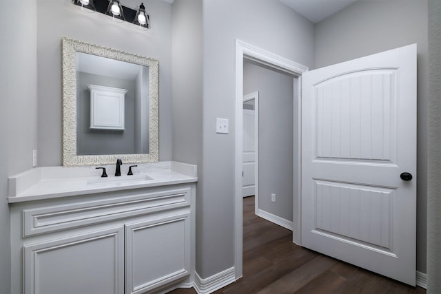 bathroom with vanity and hardwood / wood-style floors