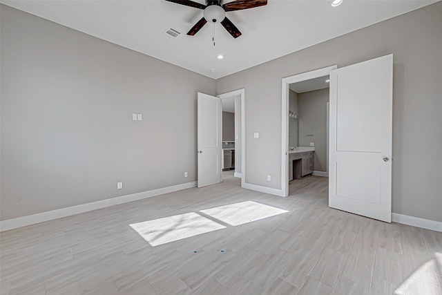 unfurnished bedroom featuring connected bathroom and ceiling fan