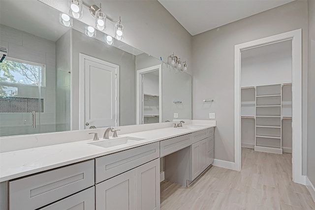 bathroom with vanity and an enclosed shower