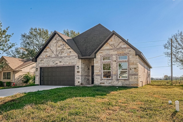 view of front facade with a front yard and a garage