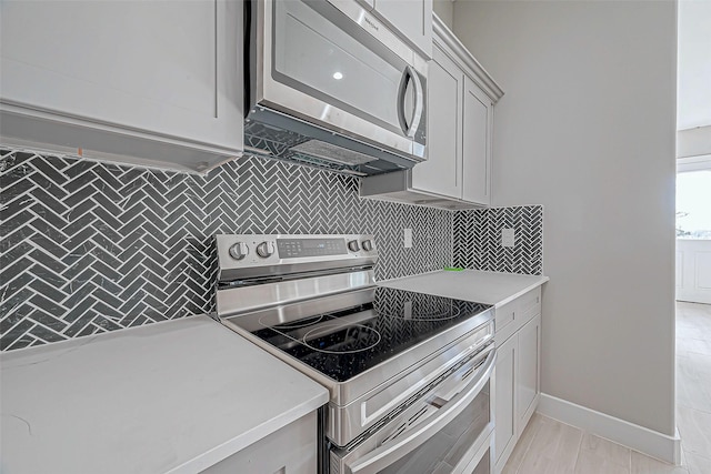 kitchen featuring backsplash and appliances with stainless steel finishes