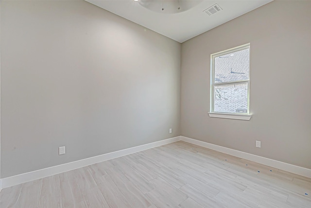 unfurnished room with light hardwood / wood-style flooring