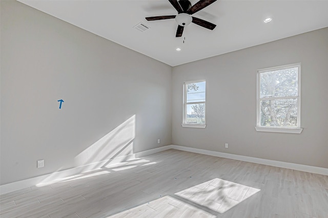 empty room with light wood-type flooring and ceiling fan