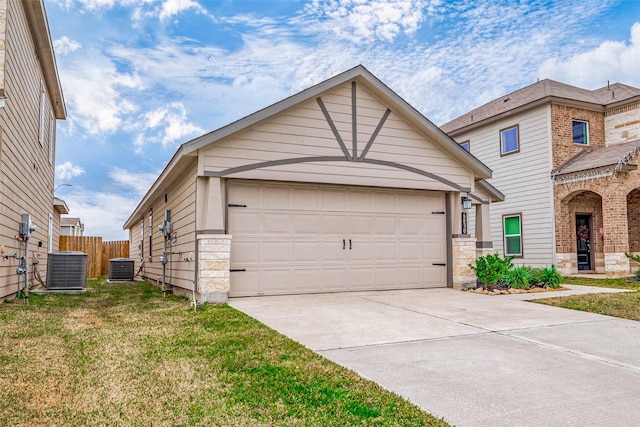 view of front of house featuring a garage, a front lawn, cooling unit, and fence