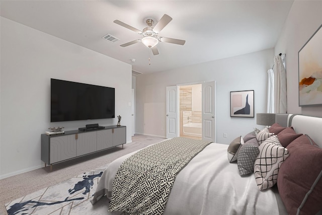 bedroom featuring ensuite bath, baseboards, visible vents, and light colored carpet