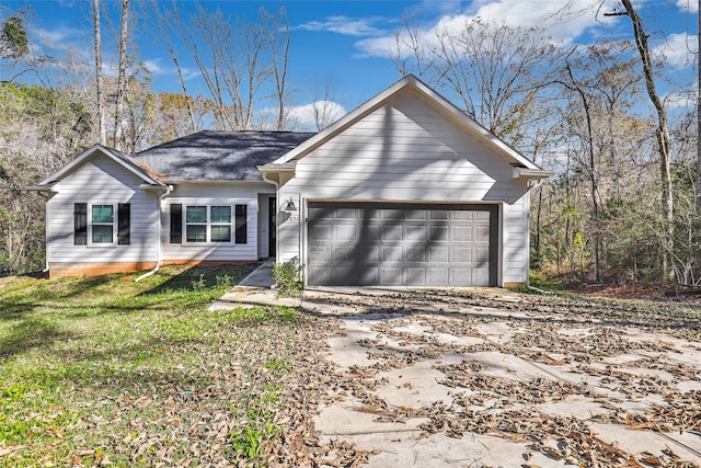 single story home with a front yard and a garage