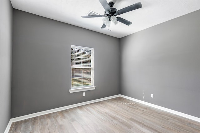 spare room with light hardwood / wood-style flooring and ceiling fan