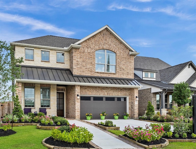 view of front of home with a garage and a front yard