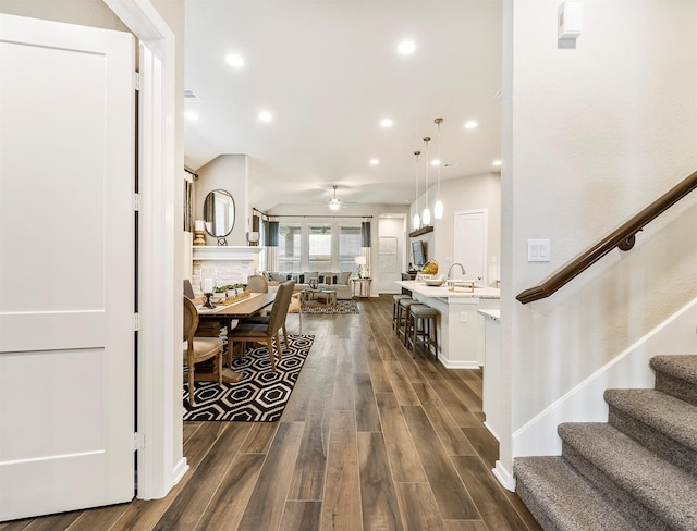 entrance foyer featuring a fireplace and ceiling fan