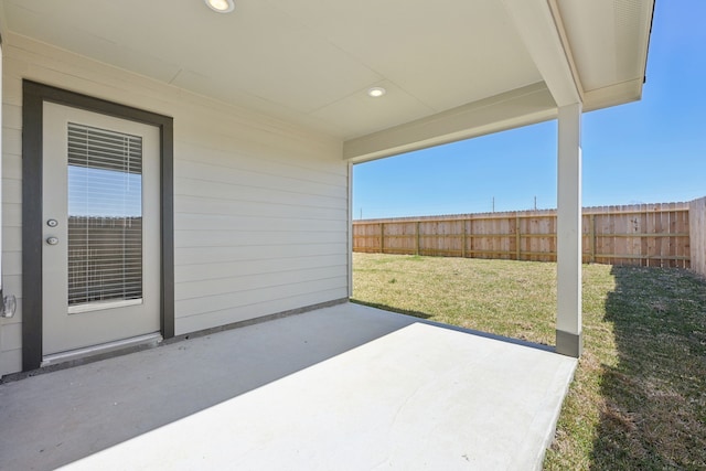 view of patio featuring fence