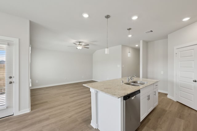 kitchen with decorative light fixtures, a kitchen island with sink, white cabinets, a sink, and dishwasher