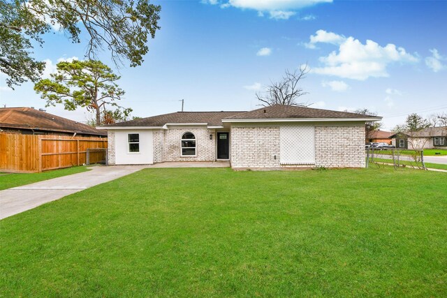 back of house with a lawn