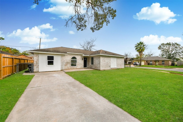 ranch-style home with a front lawn