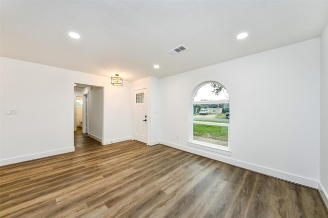 unfurnished room featuring dark hardwood / wood-style flooring