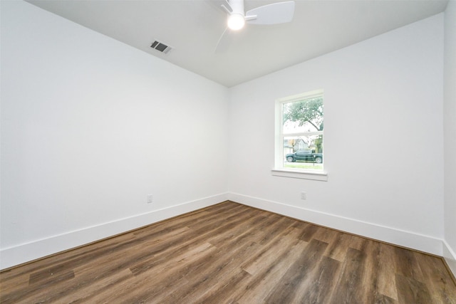 unfurnished room with ceiling fan and dark hardwood / wood-style floors