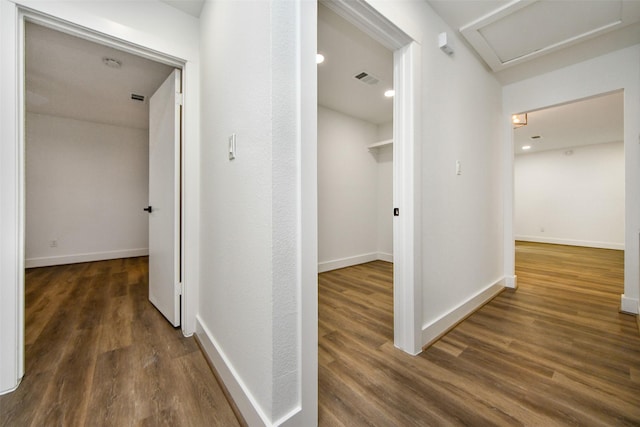 hallway featuring dark hardwood / wood-style floors