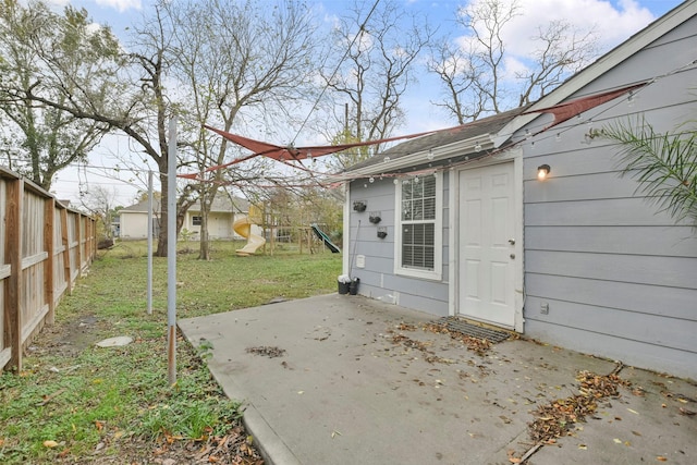 exterior space featuring a playground and a patio