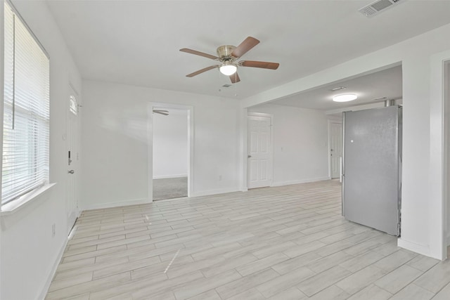 unfurnished room featuring ceiling fan and light wood-type flooring