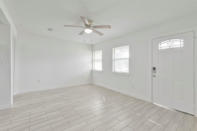 entrance foyer with ceiling fan