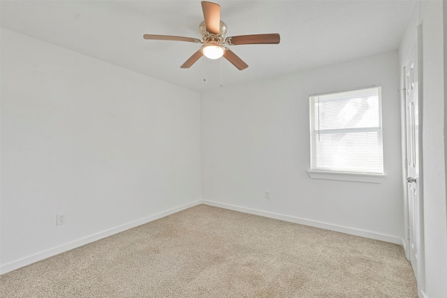 carpeted empty room with ceiling fan