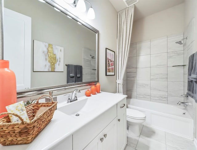 full bathroom with vanity, shower / bath combo, and toilet