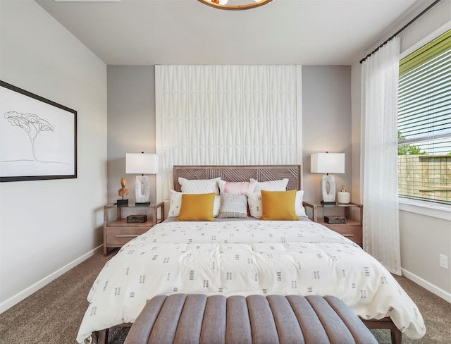 bedroom with dark colored carpet